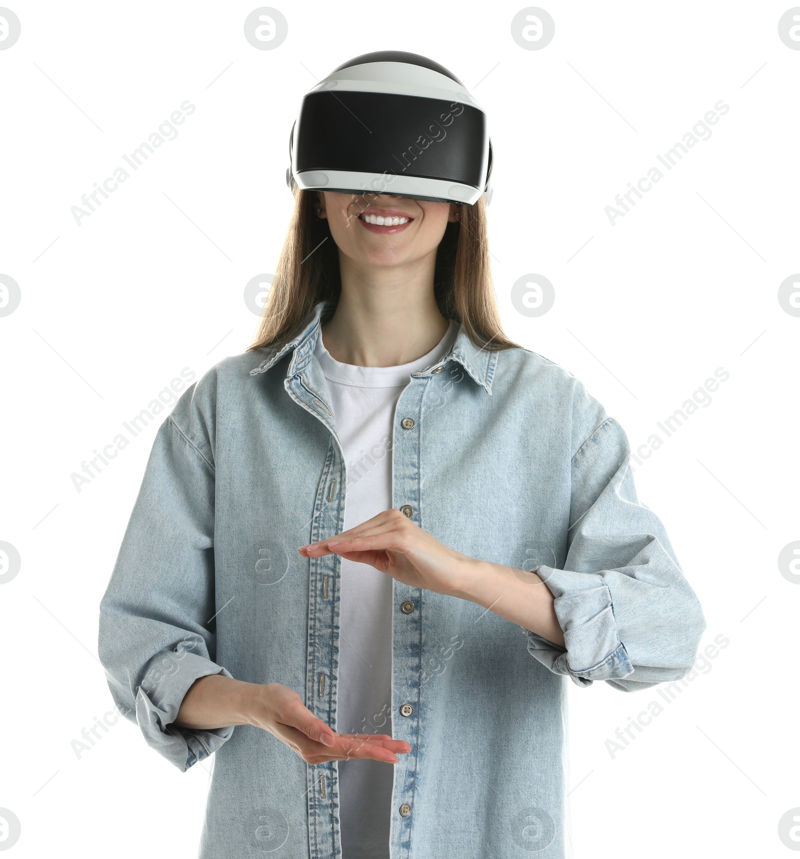 Photo of Smiling woman using virtual reality headset on white background