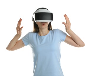 Surprised woman using virtual reality headset on white background