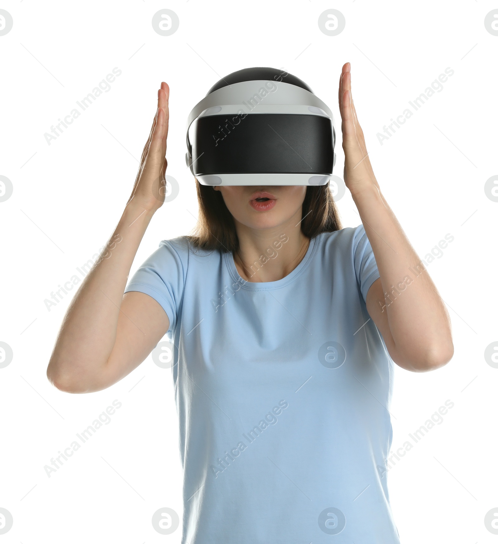 Photo of Surprised woman using virtual reality headset on white background