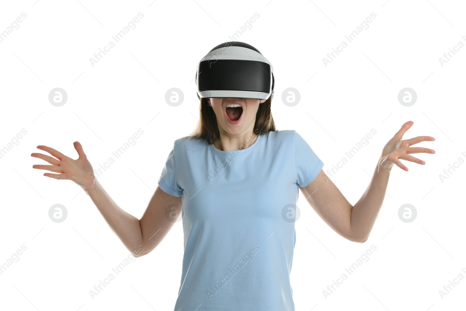 Photo of Emotional woman using virtual reality headset on white background