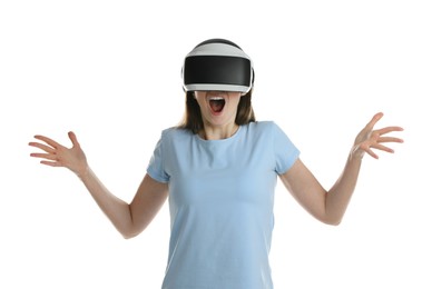 Emotional woman using virtual reality headset on white background