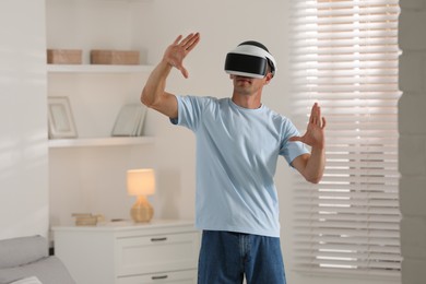 Man using virtual reality headset at home
