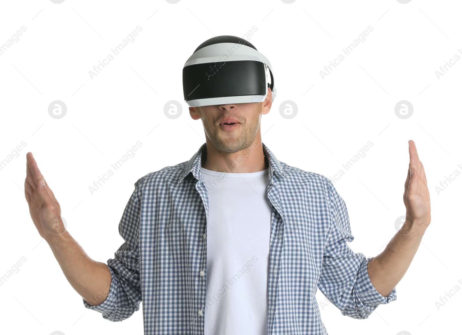 Photo of Surprised man using virtual reality headset on white background