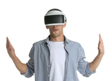 Surprised man using virtual reality headset on white background