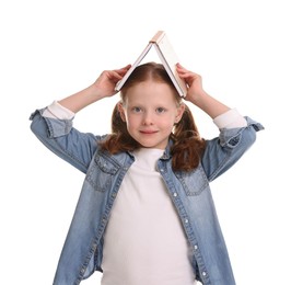 Cute little girl with book on white background