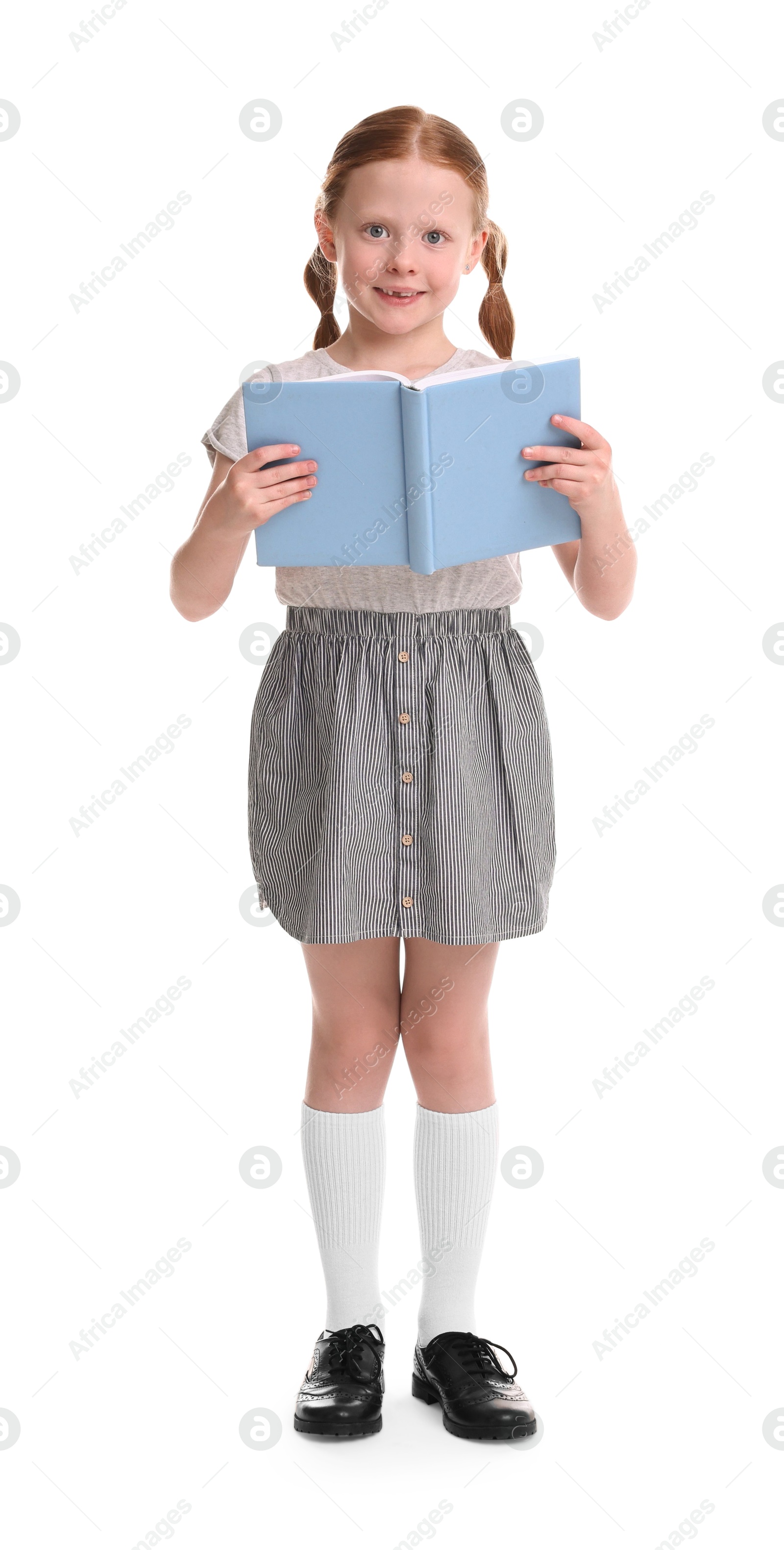 Photo of Smiling girl reading book on white background