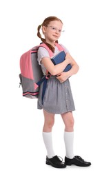 Cute little girl with books and backpack on white background