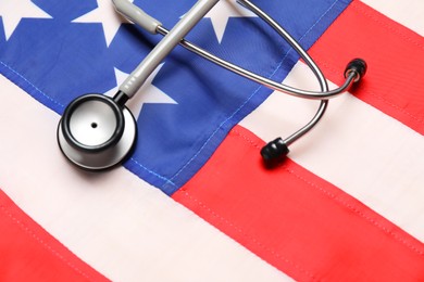 Stethoscope on USA flag, top view. Health care concept