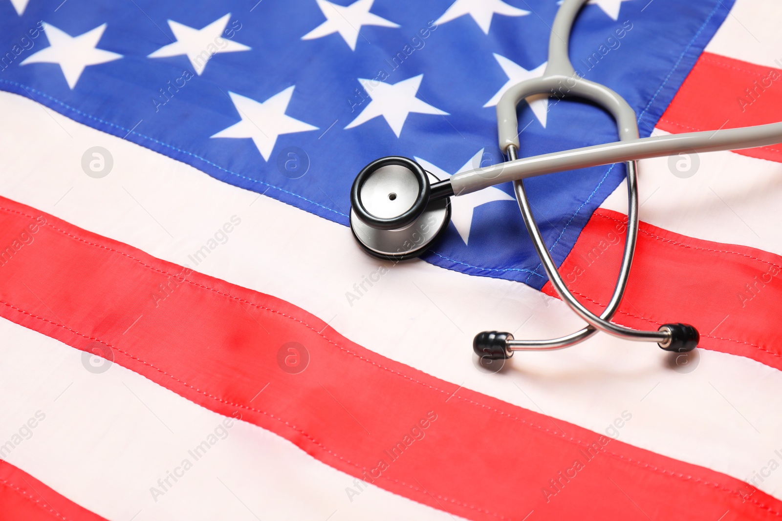 Photo of Stethoscope on USA flag, above view. Health care concept