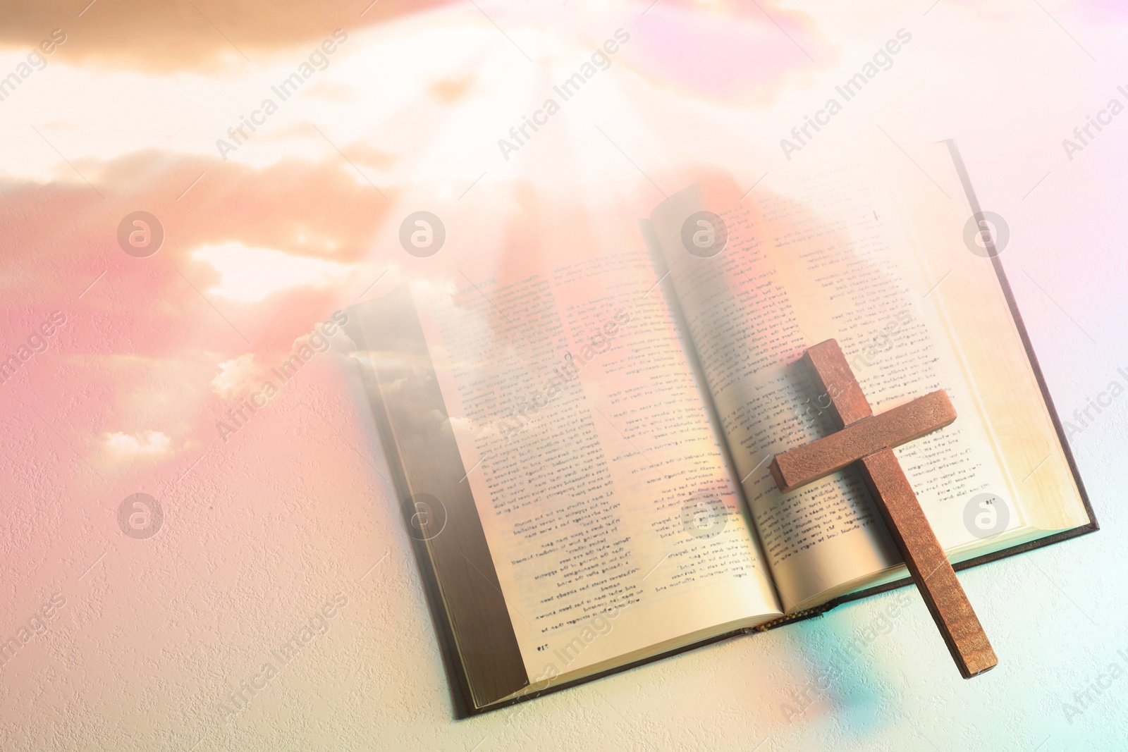 Image of Double exposure of Holy Bible with cross and sky, top view. Religion of Christianity