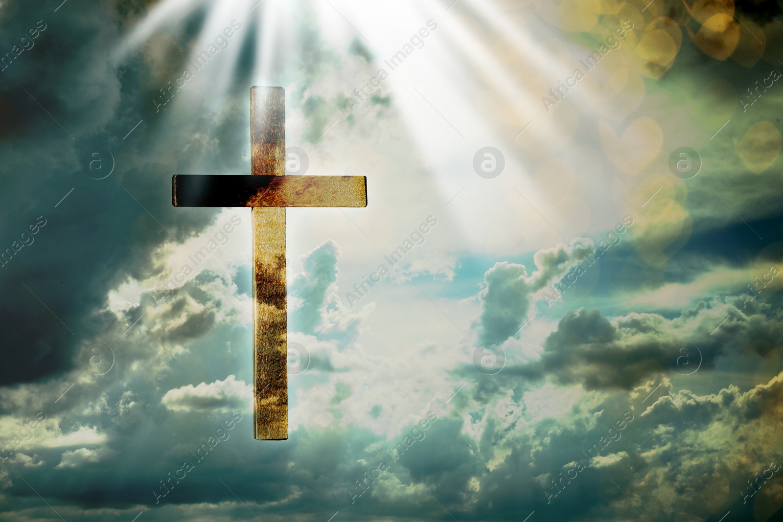 Image of Cross lit by sunlight in sky, double exposure. Religion of Christianity