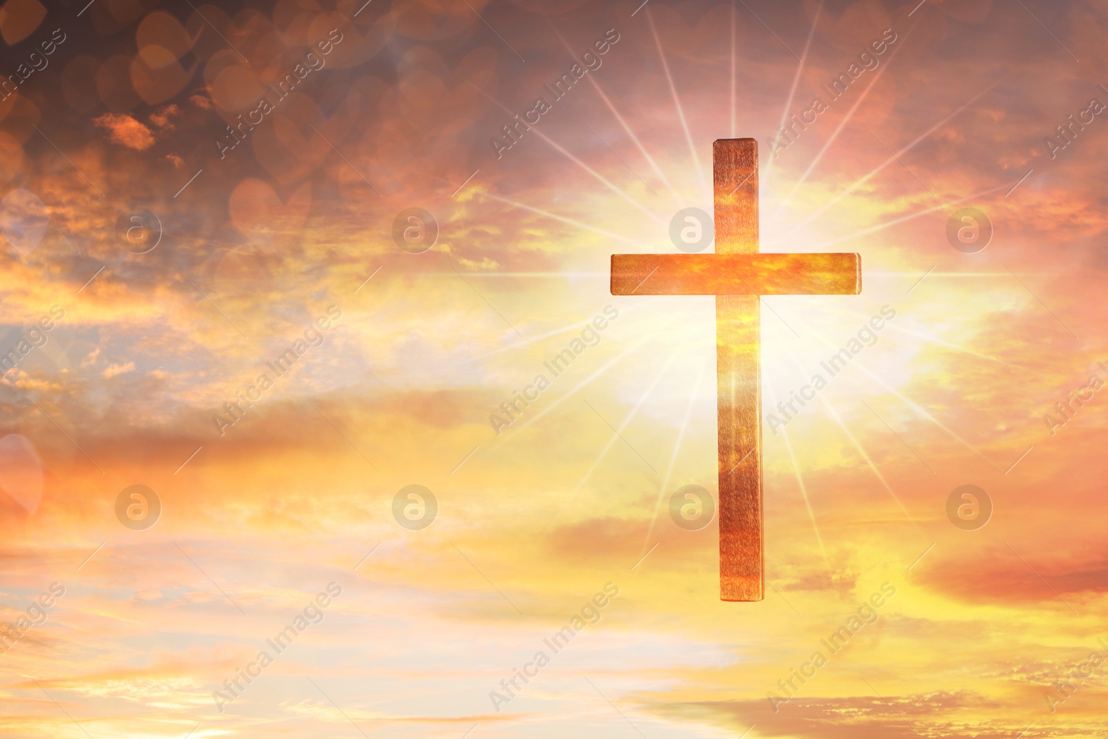 Image of Cross lit by sunlight in sky, double exposure. Religion of Christianity