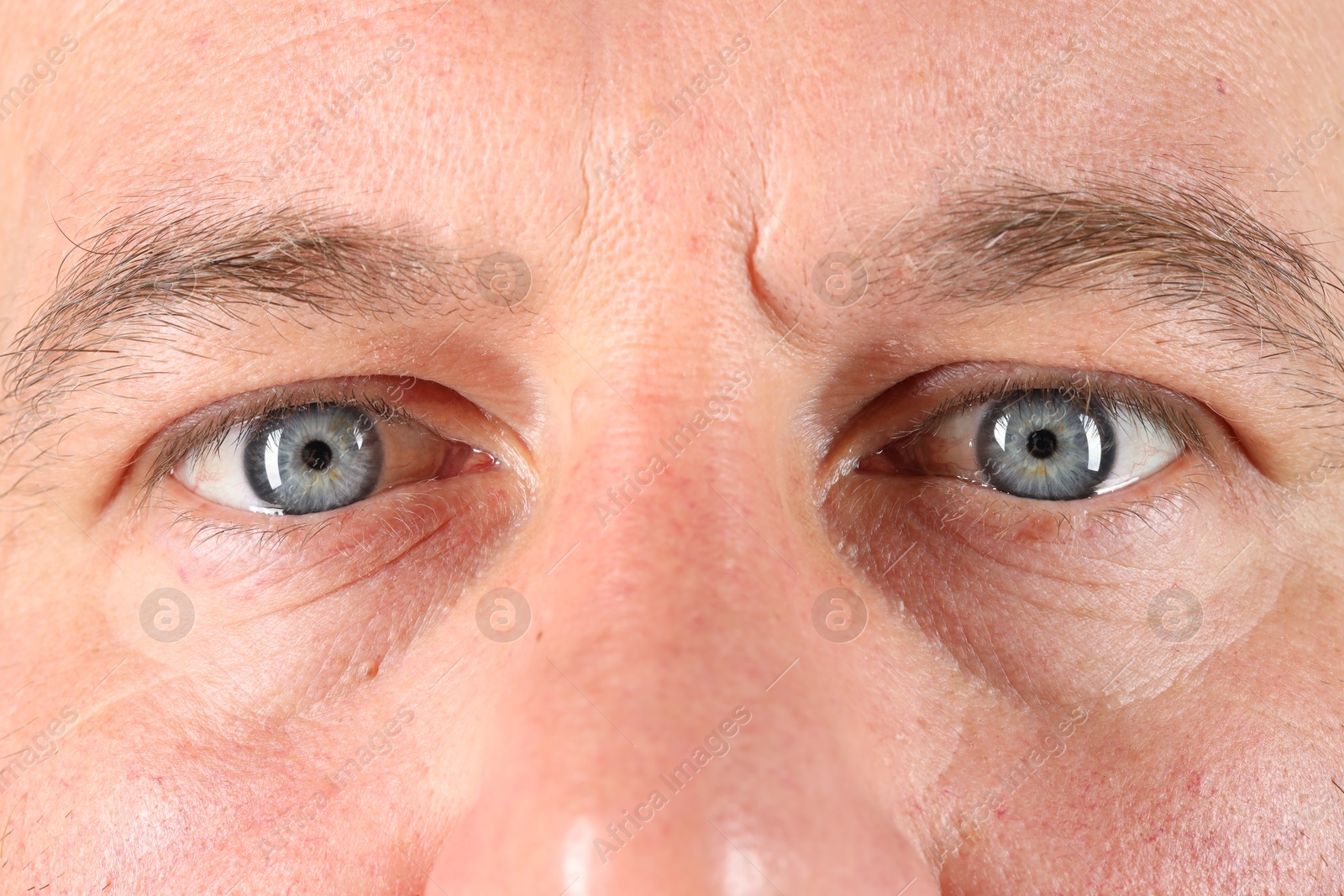 Photo of Man with beautiful blue eyes, closeup view