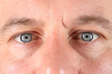 Man with beautiful blue eyes, closeup view