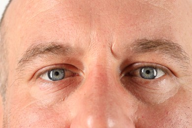 Photo of Man with beautiful blue eyes, closeup view