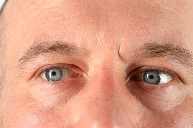 Photo of Man with beautiful blue eyes, closeup view