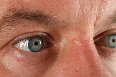 Man with beautiful blue eyes, closeup view