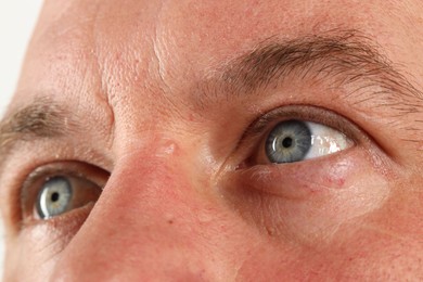 Photo of Man with beautiful blue eyes, closeup view