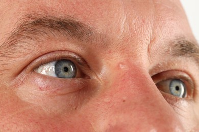 Photo of Man with beautiful blue eyes, closeup view