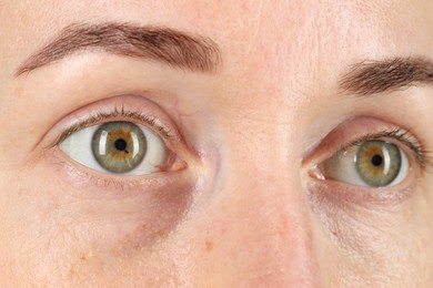 Woman with beautiful green eyes, closeup view