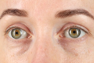 Woman with beautiful green eyes, closeup view