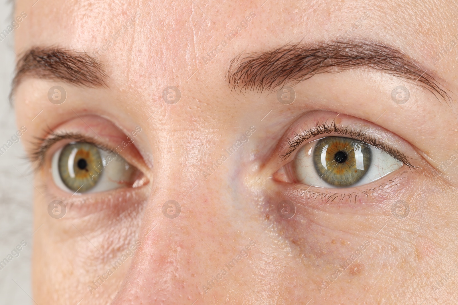 Photo of Woman with beautiful green eyes, closeup view