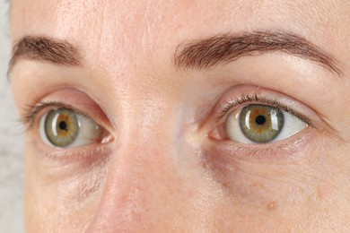 Woman with beautiful green eyes, closeup view