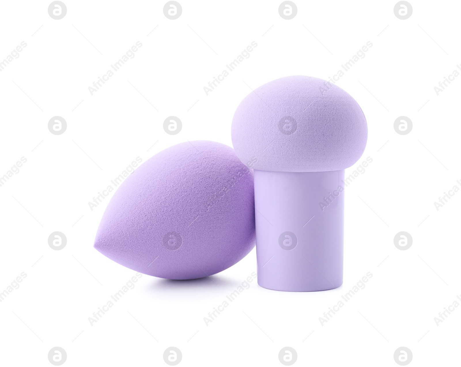 Photo of Two violet makeup sponges isolated on white