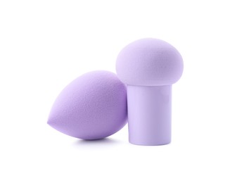 Photo of Two violet makeup sponges isolated on white