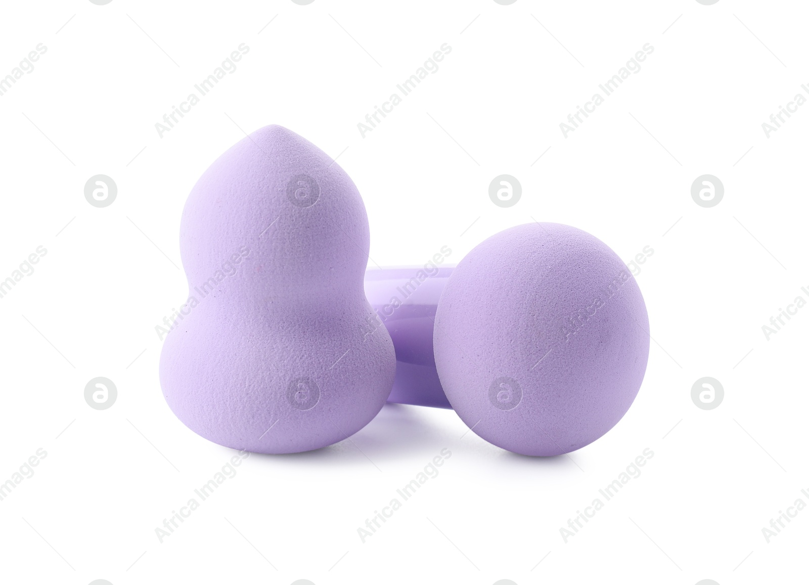 Photo of Two violet makeup sponges isolated on white