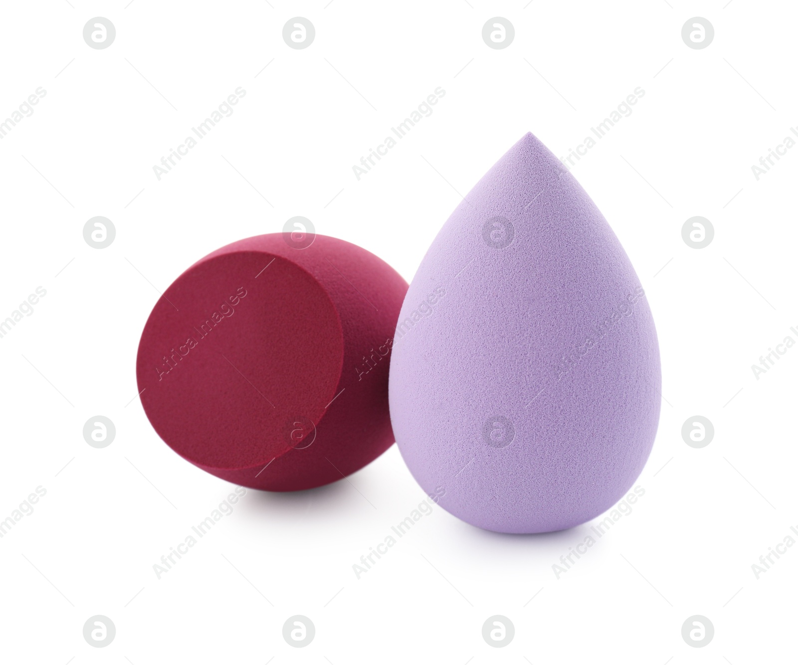 Photo of Two colorful makeup sponges isolated on white