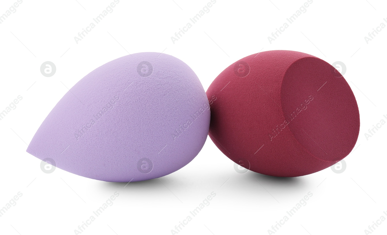 Photo of Two colorful makeup sponges isolated on white