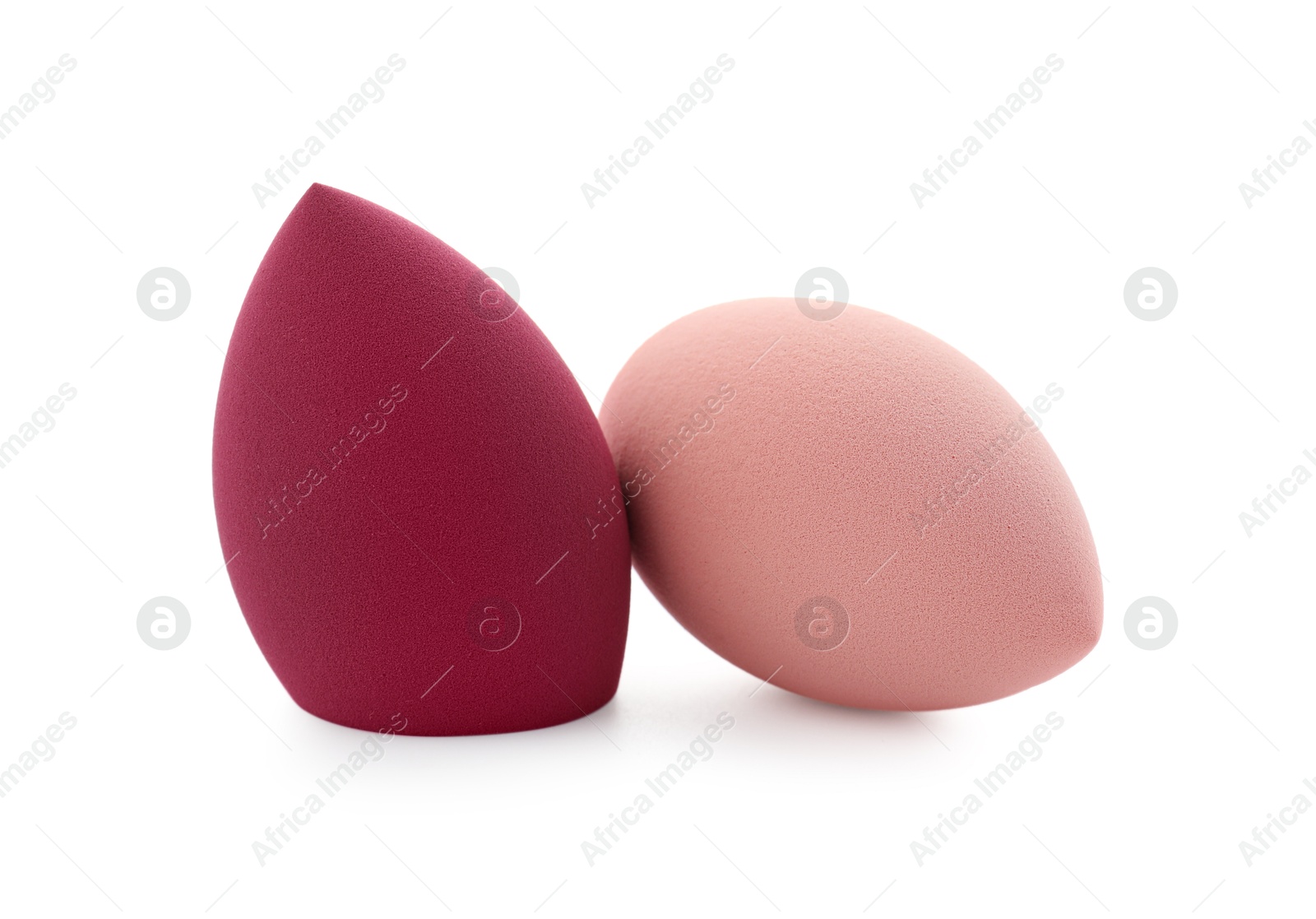 Photo of Two colorful makeup sponges isolated on white