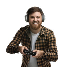 Happy man in headphones playing video game with controller on white background