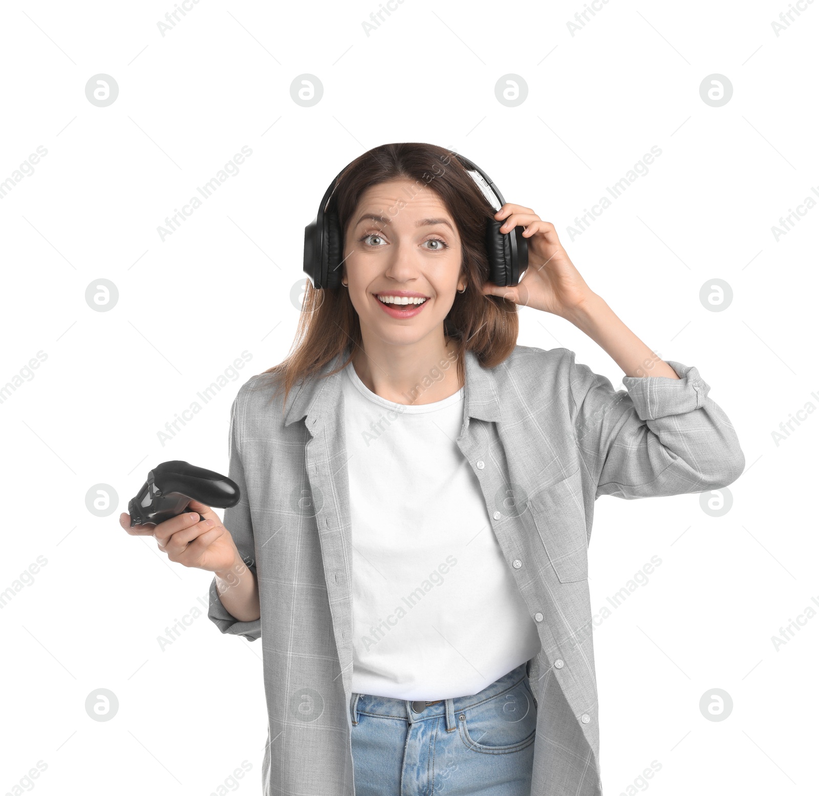 Photo of Happy woman in headphones with game controller on white background