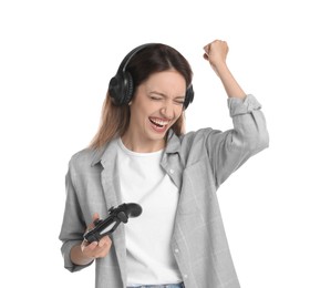 Photo of Happy woman in headphones with game controller on white background