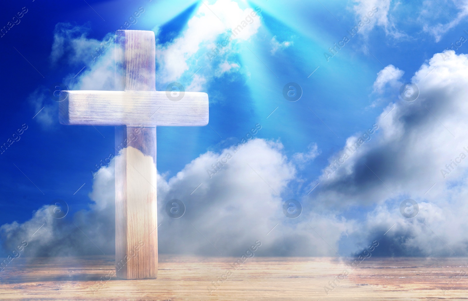 Image of Double exposure of cross on wooden table and blue sky. Religion of Christianity