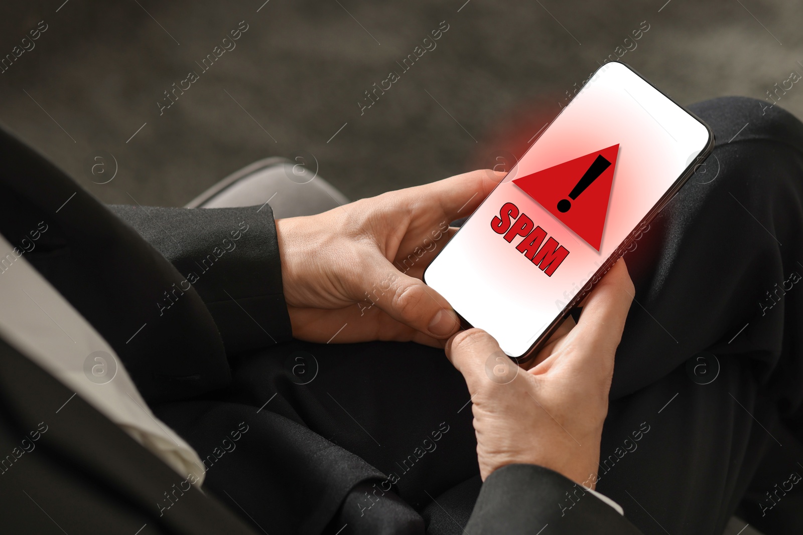 Image of Man using smartphone indoors, closeup. Spam message notification on device screen, illustration