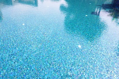 Clear water with ripples in swimming pool outdoors