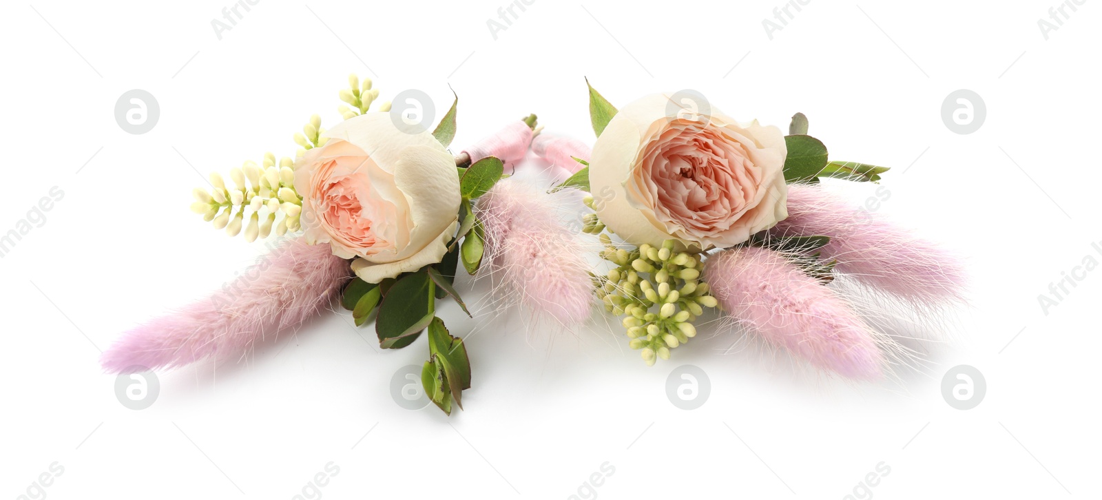 Photo of Two small stylish boutonnieres isolated on white