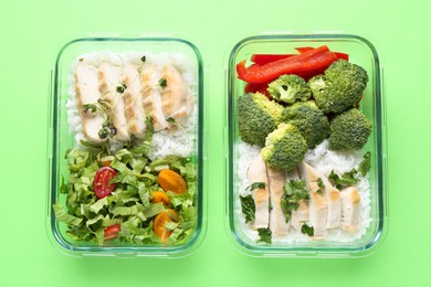 Photo of Healthy food. Different meals in glass containers on green background, top view