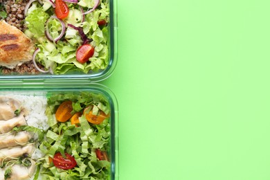 Photo of Healthy food. Different meals in glass containers on green background, top view. Space for text