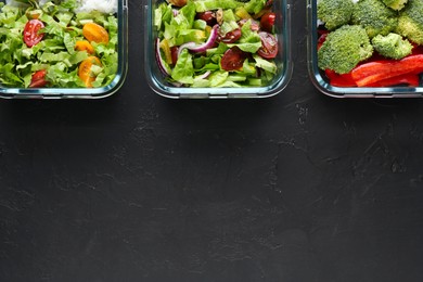 Healthy food. Different meals in glass containers on black table, flat lay. Space for text