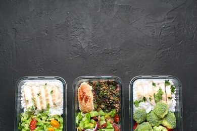 Photo of Healthy food. Different meals in glass containers on black table, flat lay. Space for text