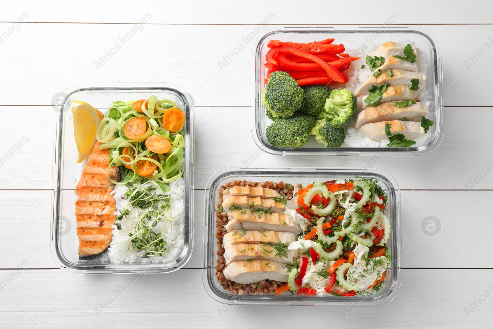 Photo of Healthy meal. Containers with different products on white wooden table, flat lay