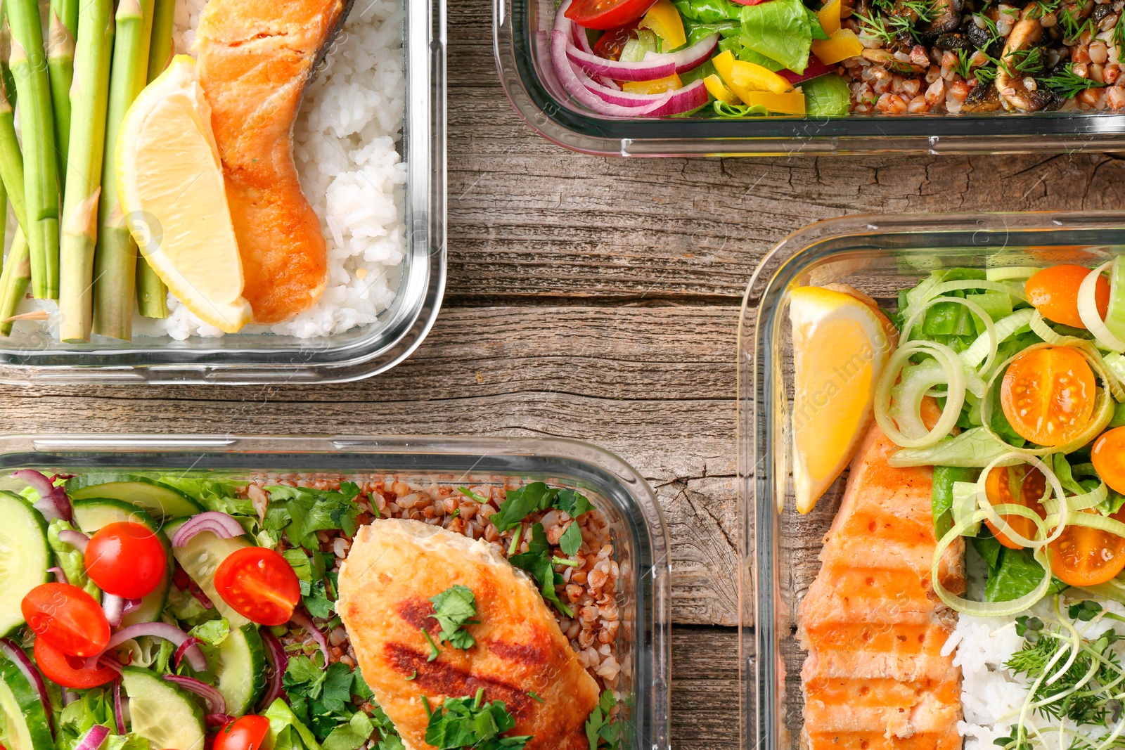 Photo of Healthy meal. Containers with different products on wooden table, flat lay