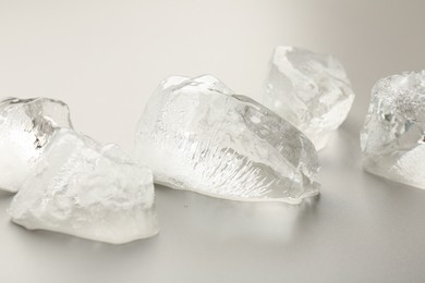 Photo of Pieces of crushed ice on grey background