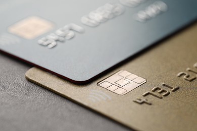 Photo of Plastic credit cards on table, macro view