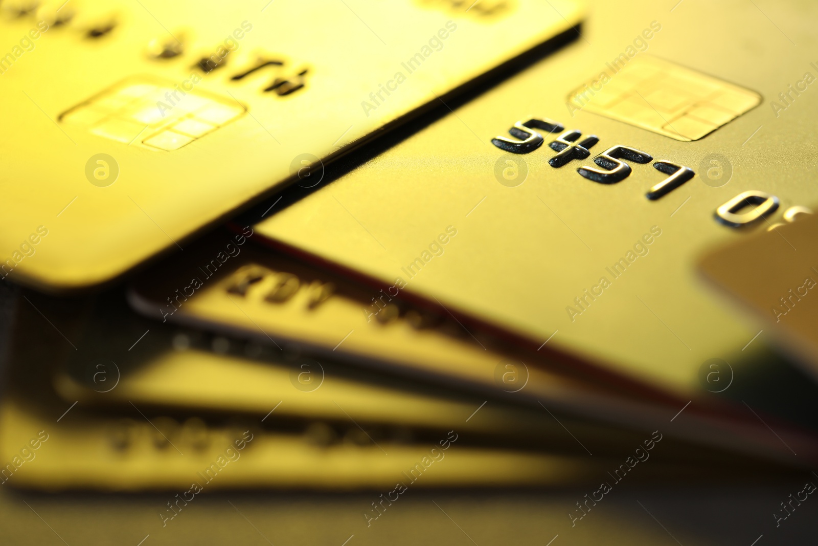 Photo of Plastic credit cards on table, macro view