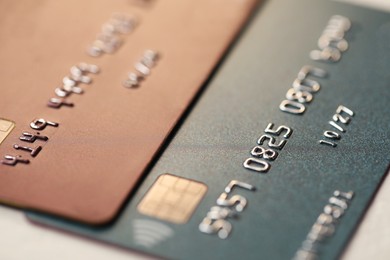 Photo of Two credit cards on table, closeup view